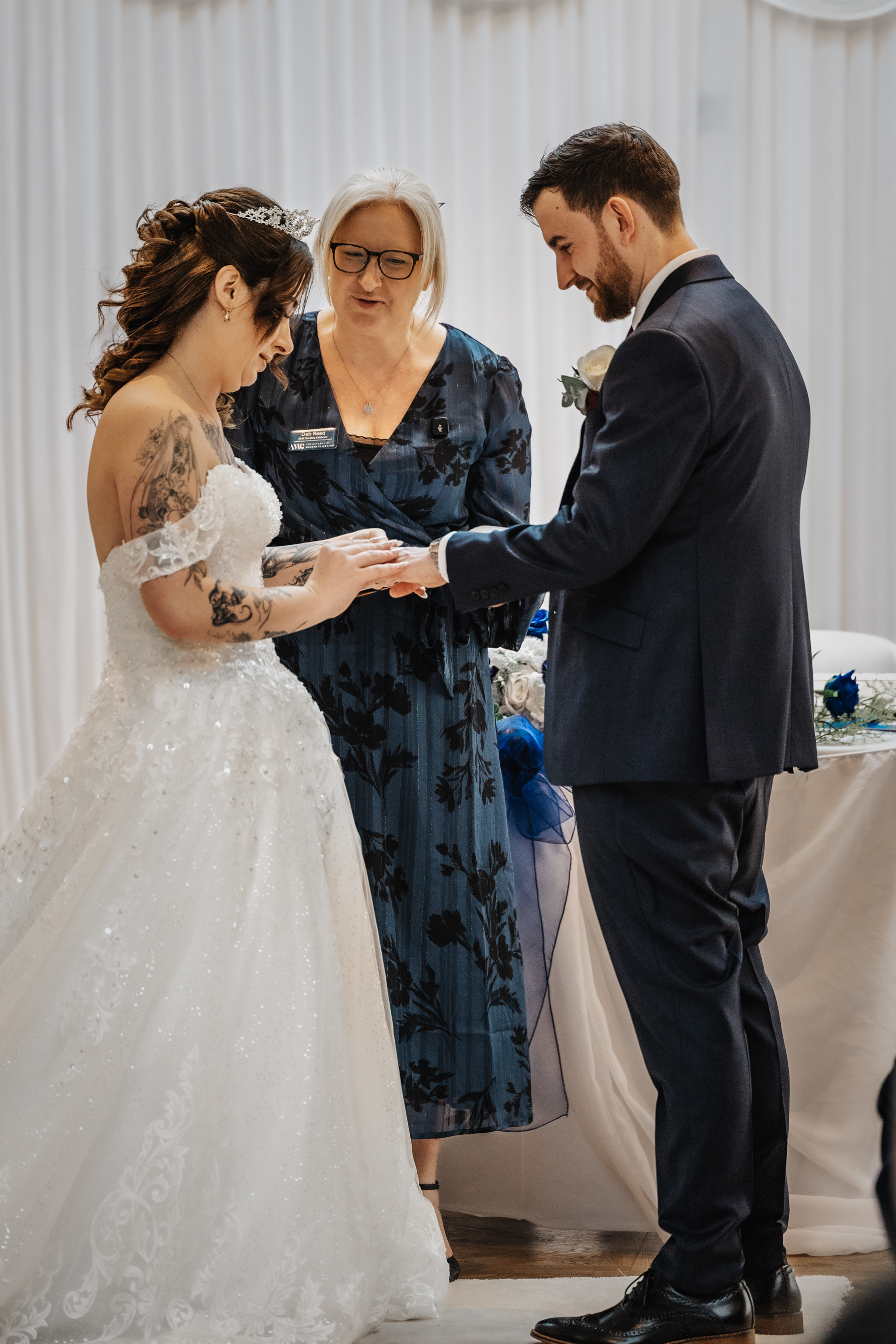 Deb Reed Celebrant Colchester Essex, officiating at the wedding of Cheyney and Albert during their first kiss.